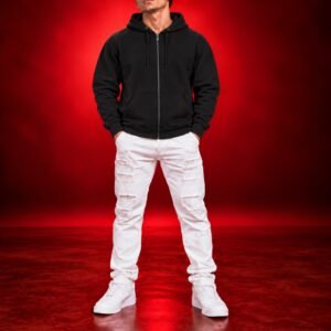 Male model wearing a black Gildan 18600 full-zip hoodie, front view on a red studio background